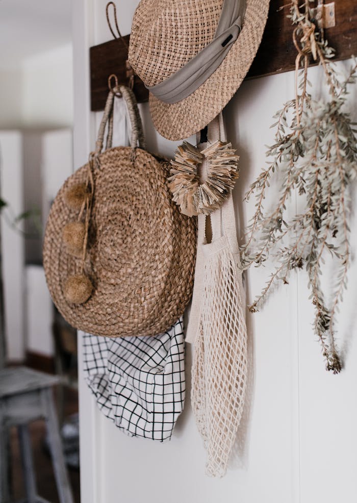 Cozy arrangement of straw hats and bags, perfect for rustic decor inspiration.